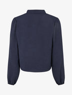 Blusa fluida con corte redondeado y detalle de ganchillo